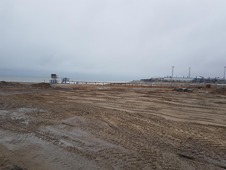 Территория после ликвидации здания электростанции в бывшем вахтовом посёлке Карской нефтегазоразведочной экспедиции